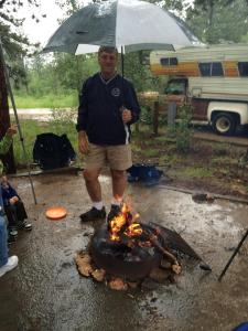 The umbrella sheltering the fire seemed like a good idea, until the smoke got caught in it and suffocated my dad.